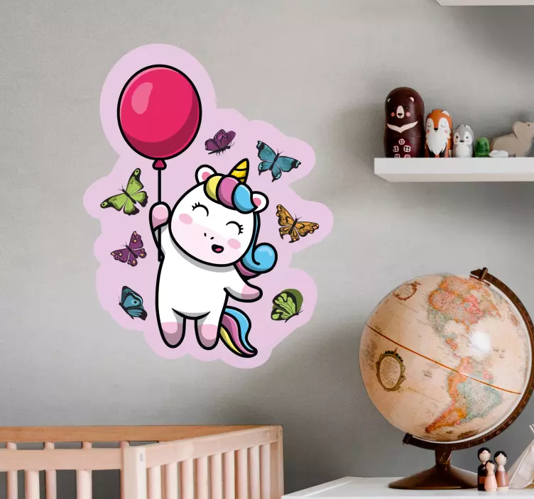 Sticker pared infantil unicornio juguetón con globo - TenVinilo