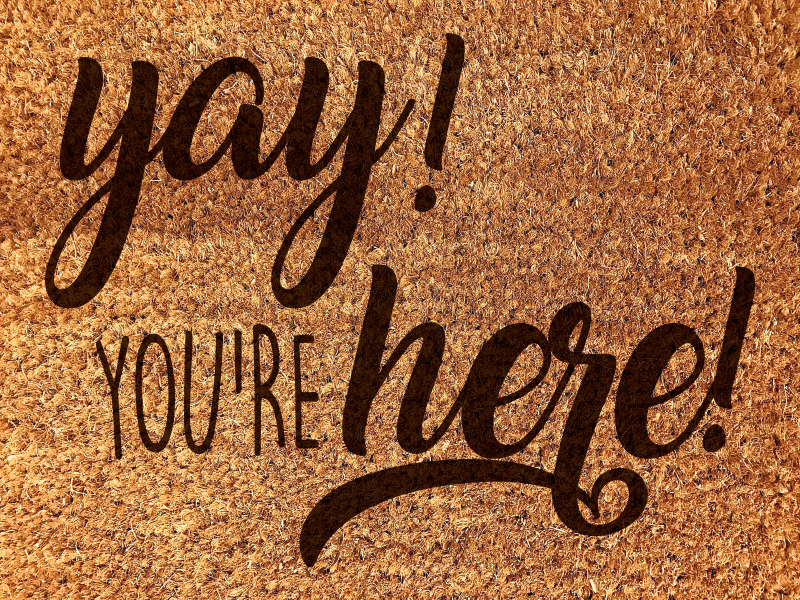 Alfombra vinílica recibidor frase de cálida bienvenida - TenVinilo